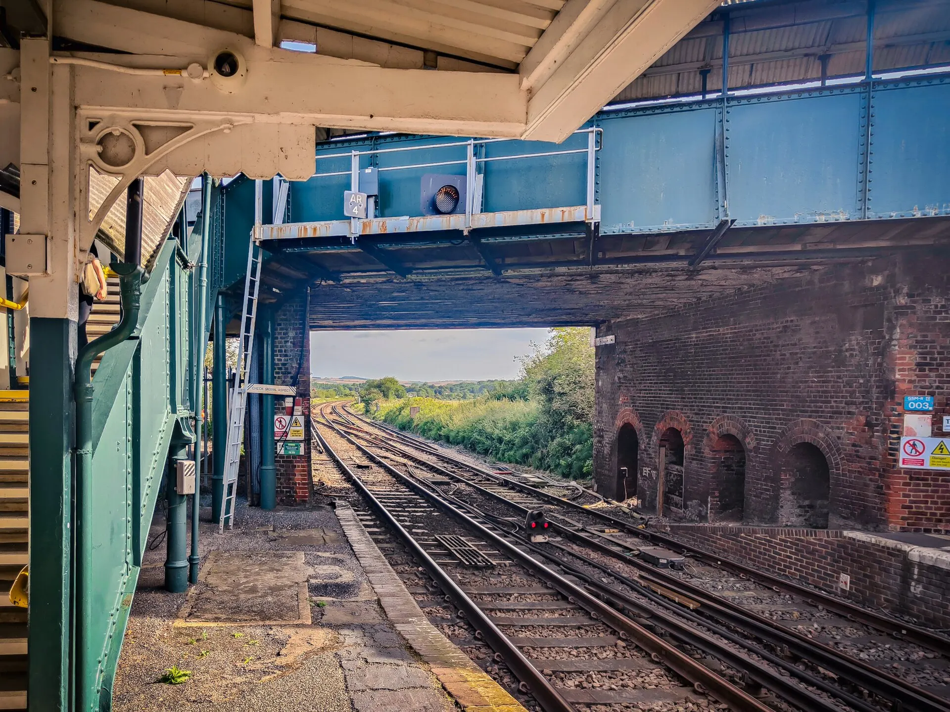 Tracks beneath the footbridge at Arundel railway station in August 2024
