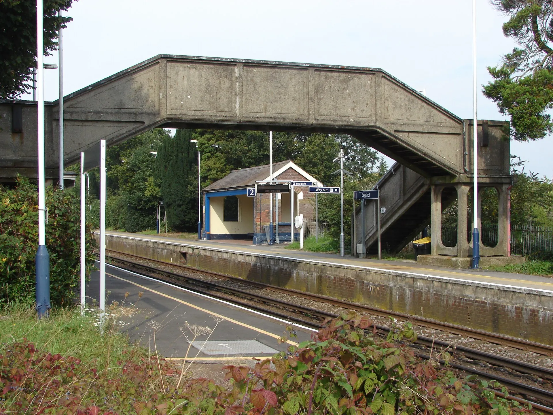 Platform and footbridge at Bagshot railway station in September 2014