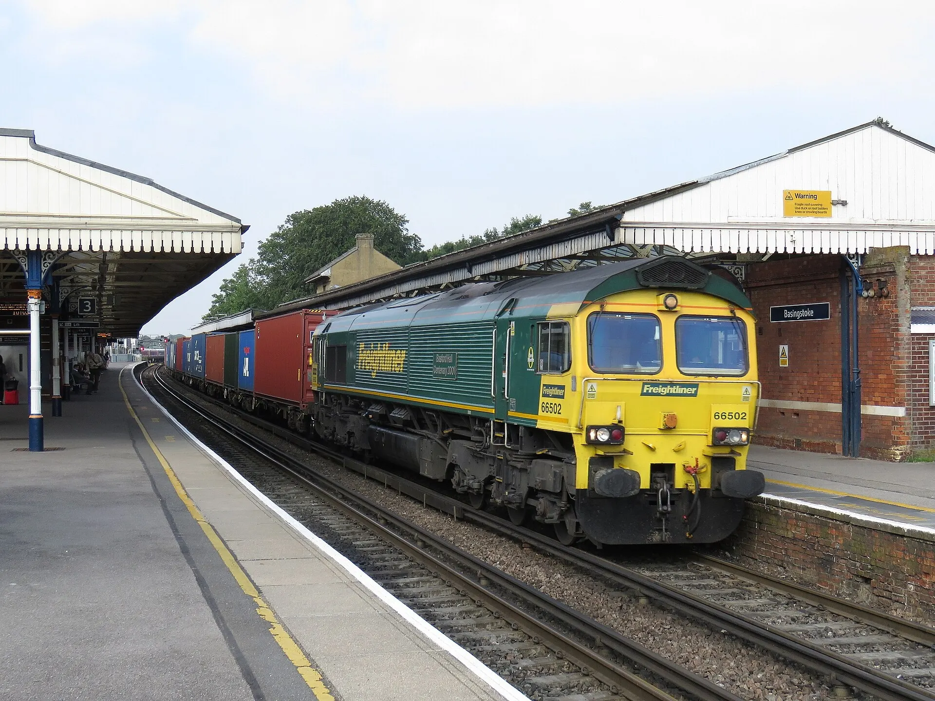 A train beside a platform at Basingstoke station
