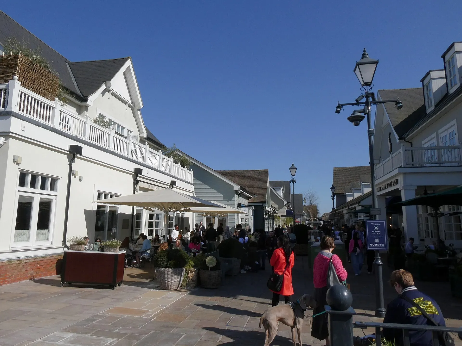 Pedestrian shopping street at Bicester Village in a 2025 photograph