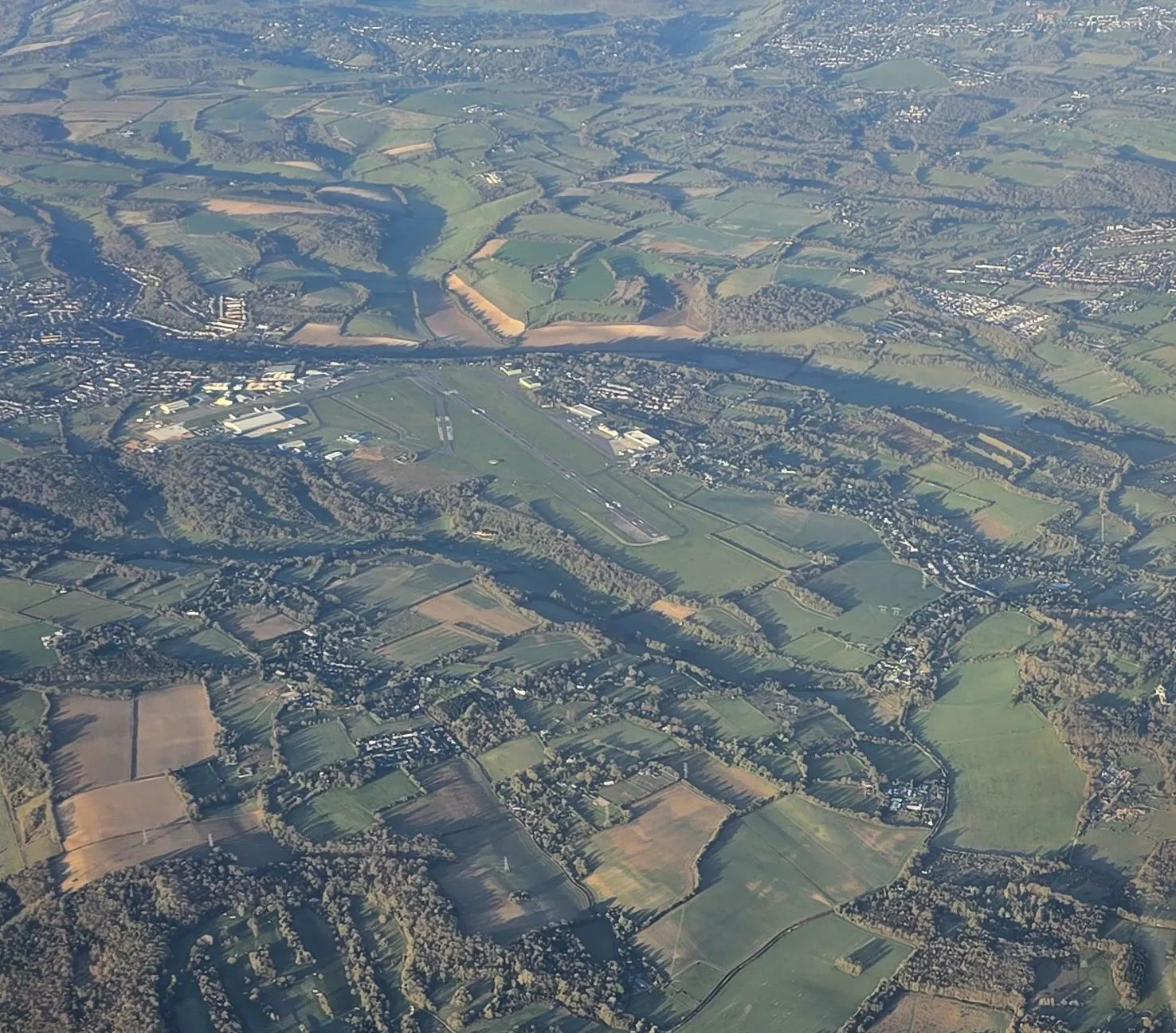 Biggin Hill Airport runway, apron and surrounding Kent landscape photographed from the air in March 2025