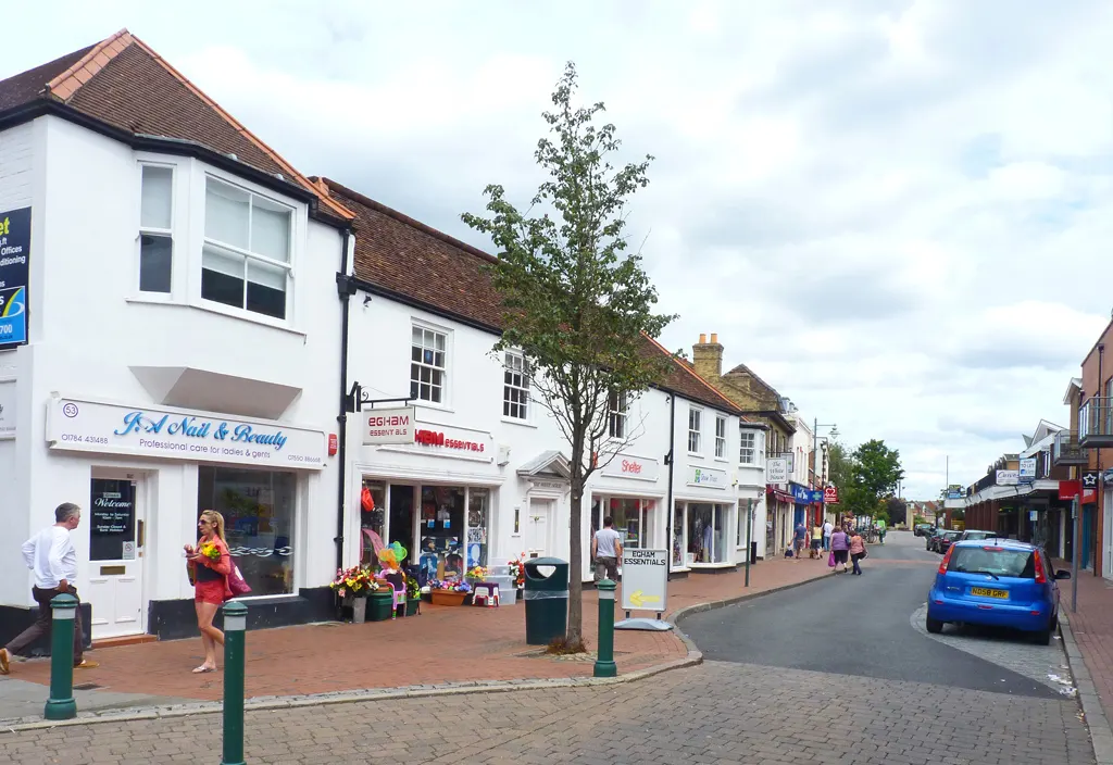 Shops and pedestrians on Egham High Street in August 2013