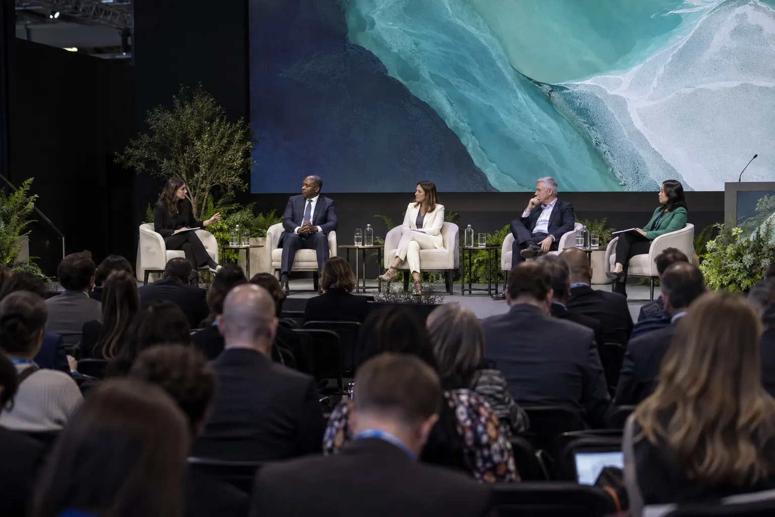 Illustrative climate finance and clean energy panel with professional delegates