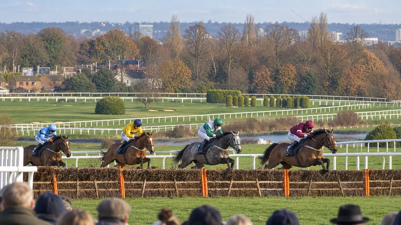 Illustrative winter jump racing at Sandown Park, based on the real course layout