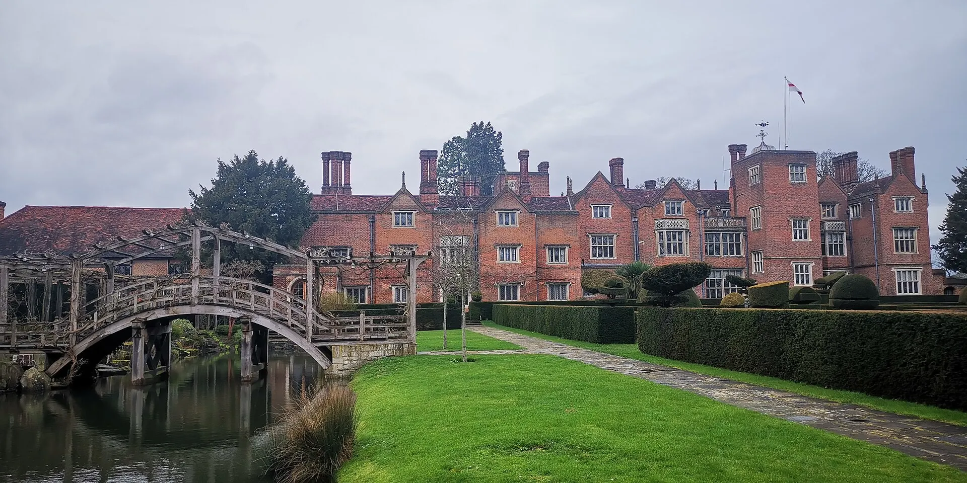 Great Fosters red-brick house and Japanese bridge in 2020