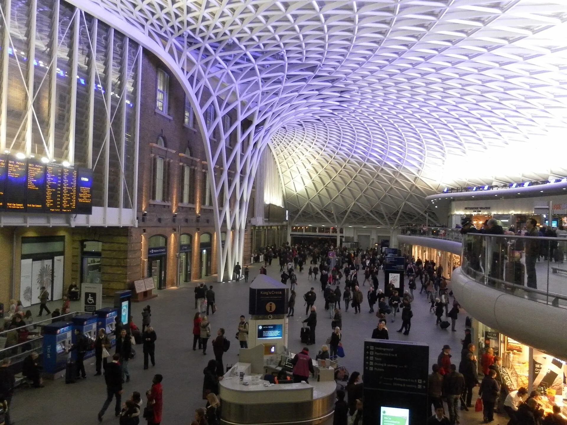 Passengers beneath the Western Concourse roof at King's Cross
