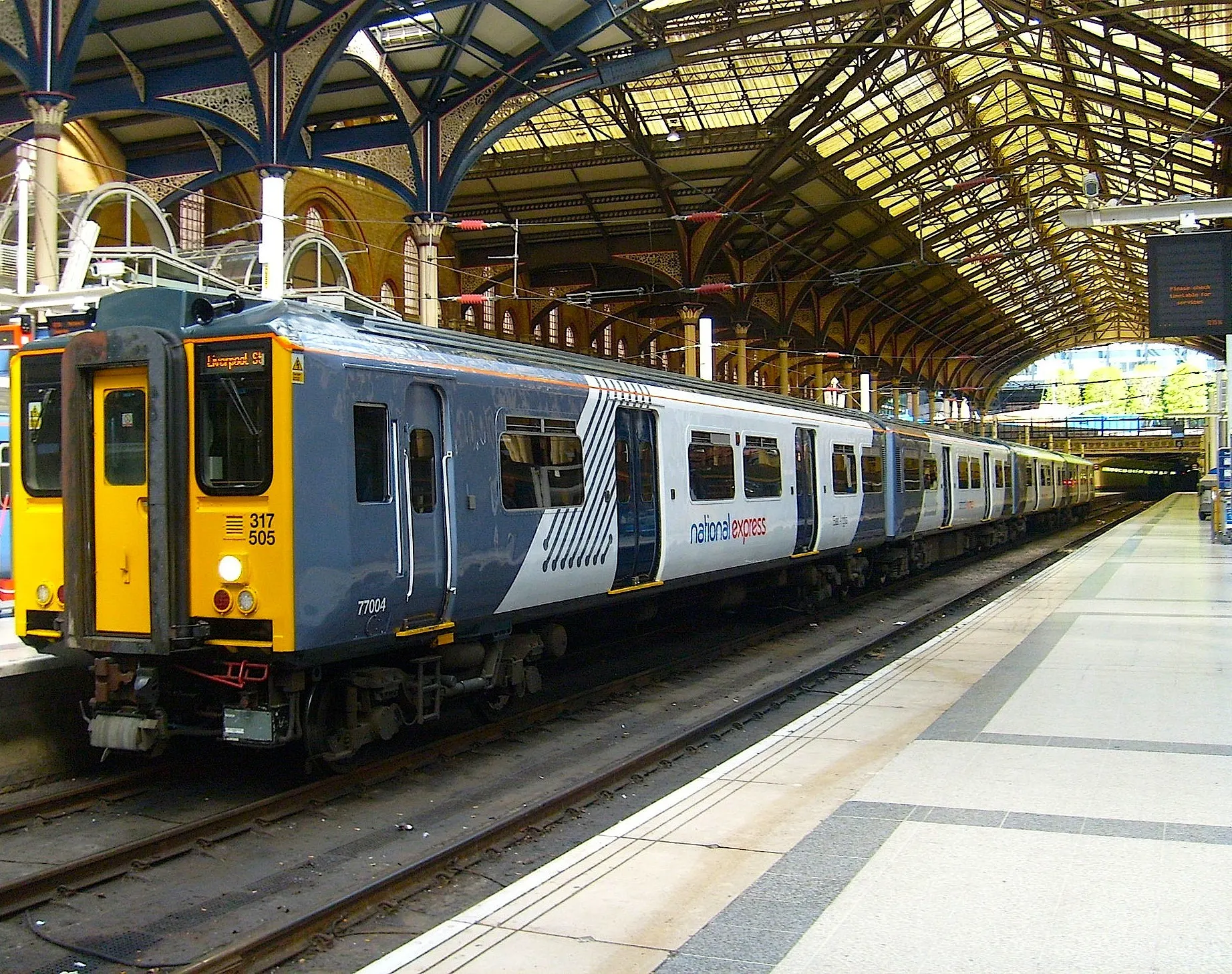 Train under the historic trainshed roof at Liverpool Street station
