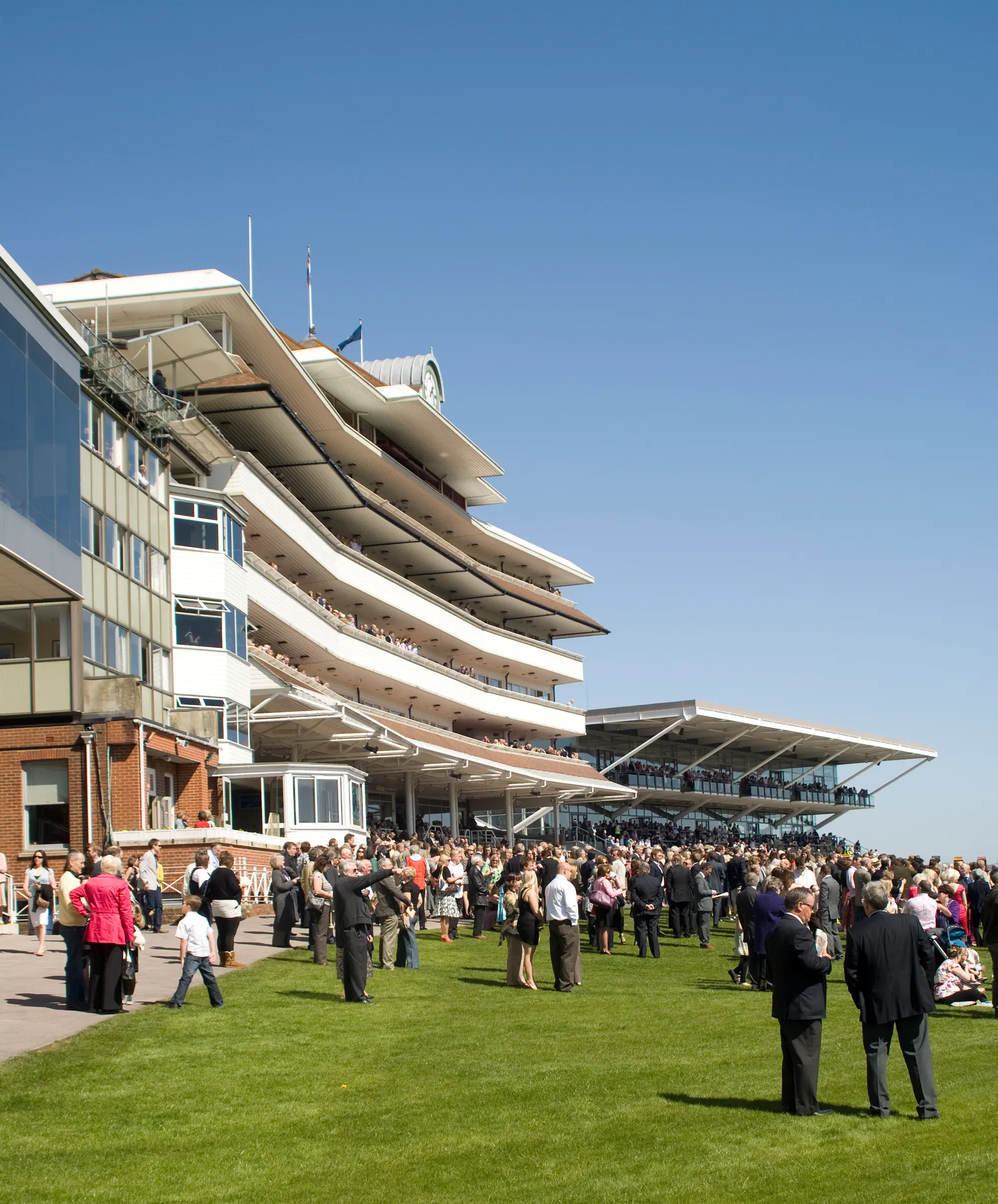 Racegoers outside the Newbury Racecourse grandstand