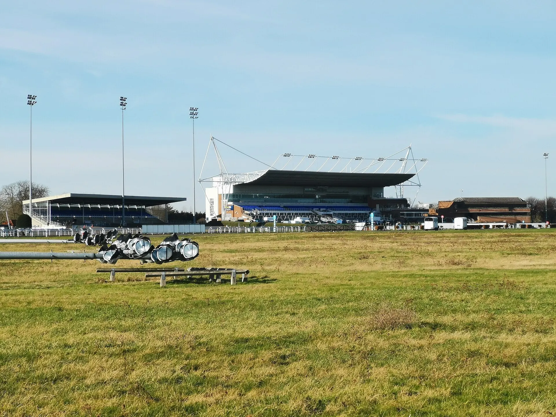Kempton Park Racecourse grandstand beyond the turf course
