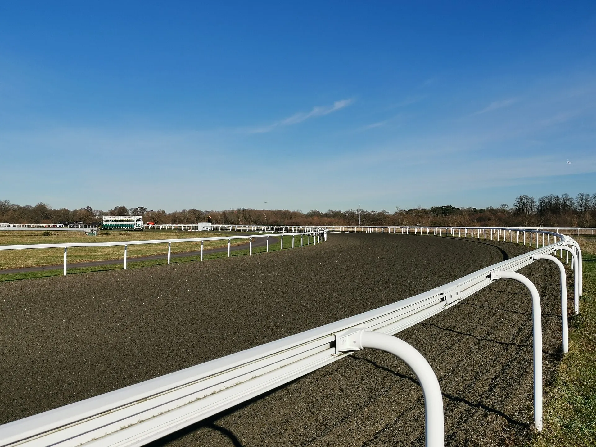 Course rails and all-weather track at Kempton Park Racecourse
