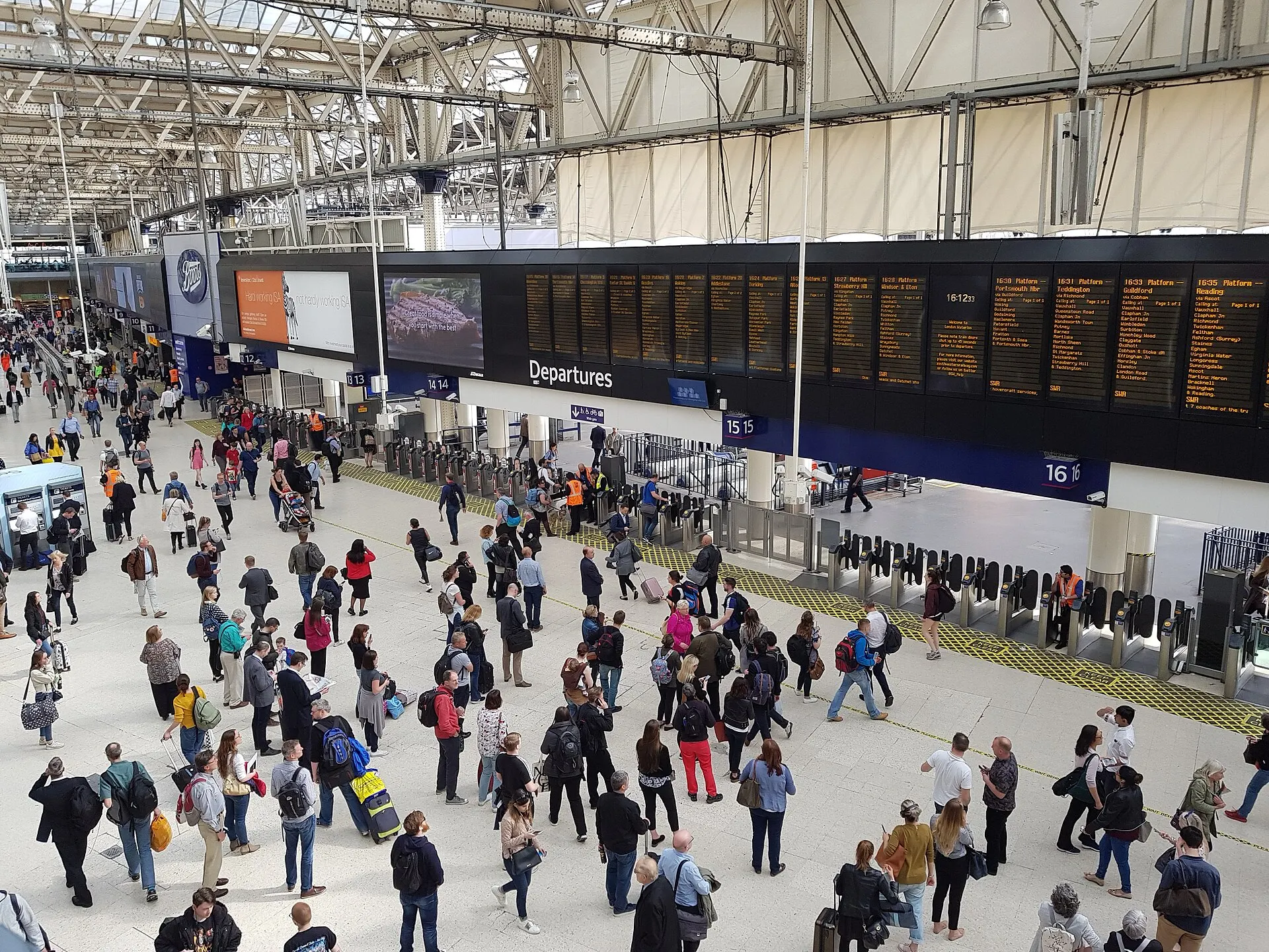 Passengers crossing London Waterloo's main concourse in May 2018