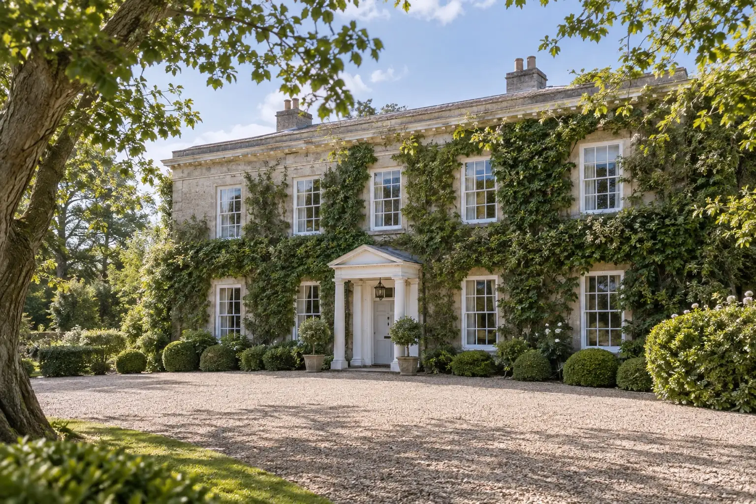 Illustrative spring view of Northbrook Park's ivy-covered manor and gravel forecourt