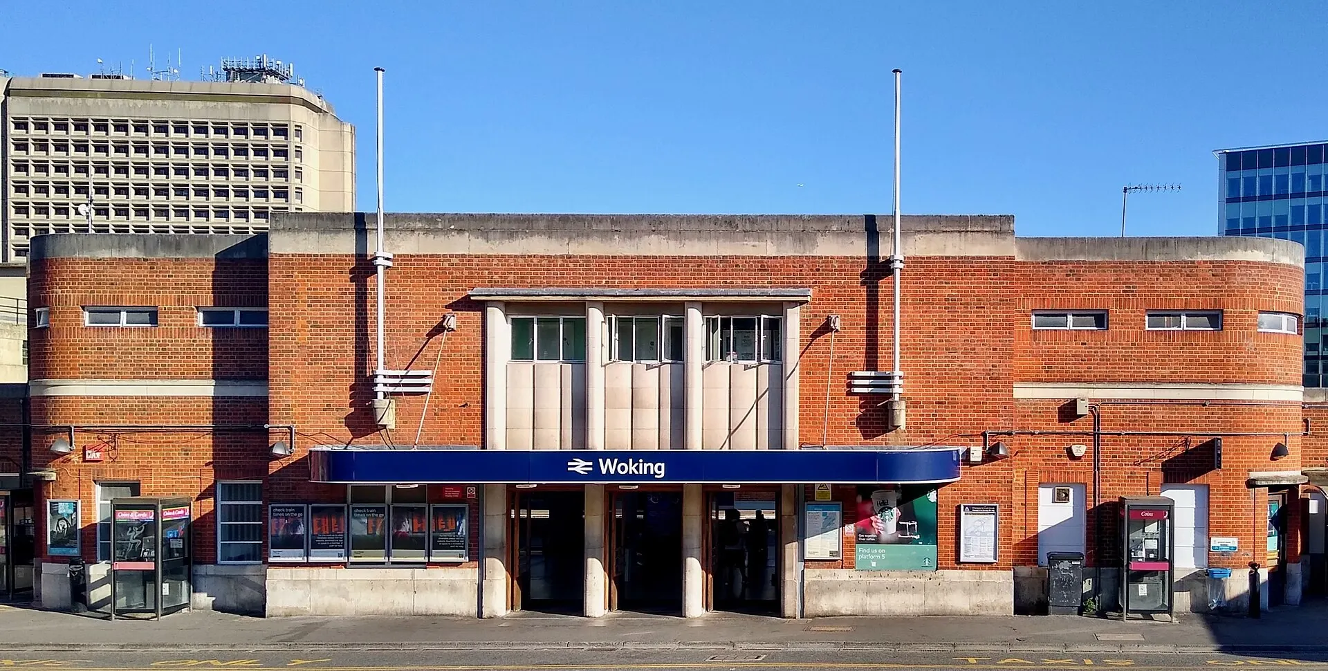 The brick entrance frontage of Woking railway station