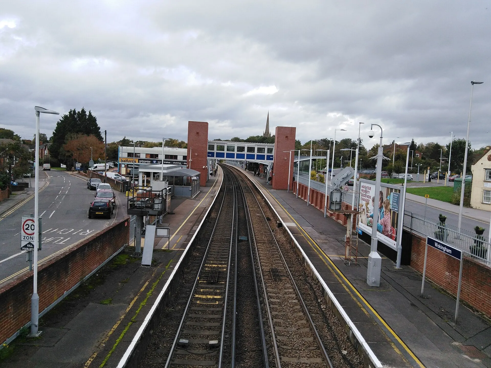 Wokingham station and footbridge viewed over the tracks in October 2021